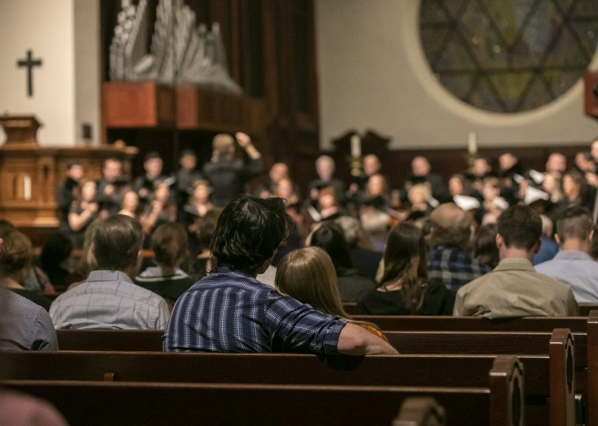 Couple watch on at an Open Rehearsal of the Phoenix Chorale